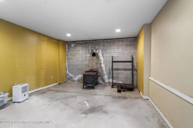 a room with gym equipment and windows