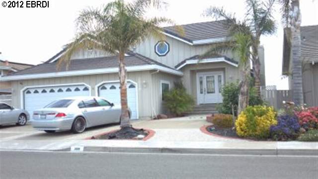 a view of a cars park in front of a building