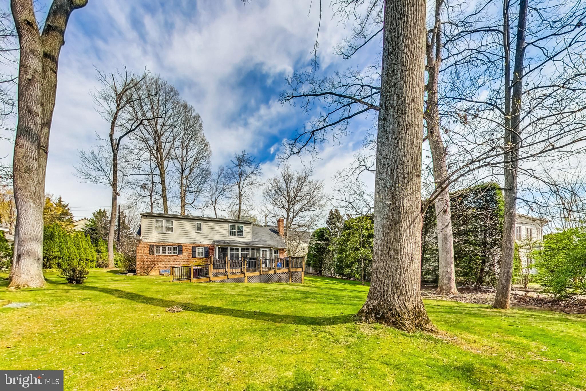 a view of a house with a yard and sitting area