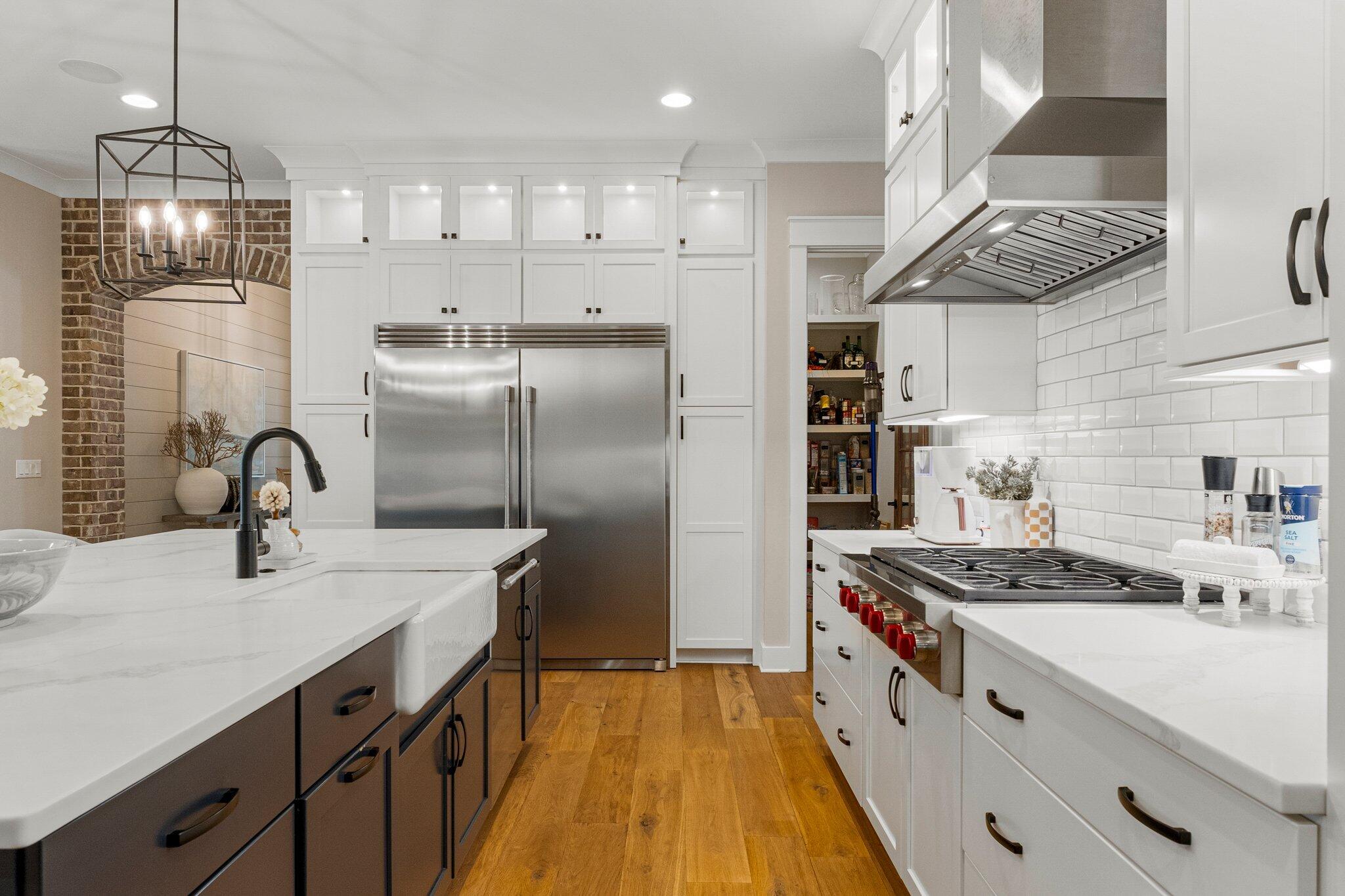 207 Pheasant Way Road Santa Rosa Beach, FL 32459 - Photo 23 of 70 a kitchen with stainless steel appliances granite countertop a sink a stove and a refrigerator