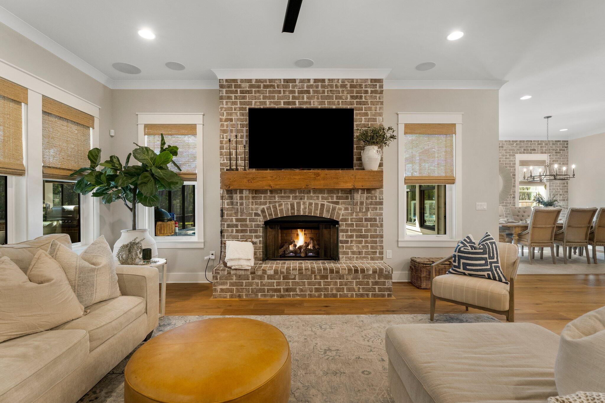 207 Pheasant Way Road Santa Rosa Beach, FL 32459 - Photo 27 of 70 a living room with furniture a flat screen tv and a fireplace