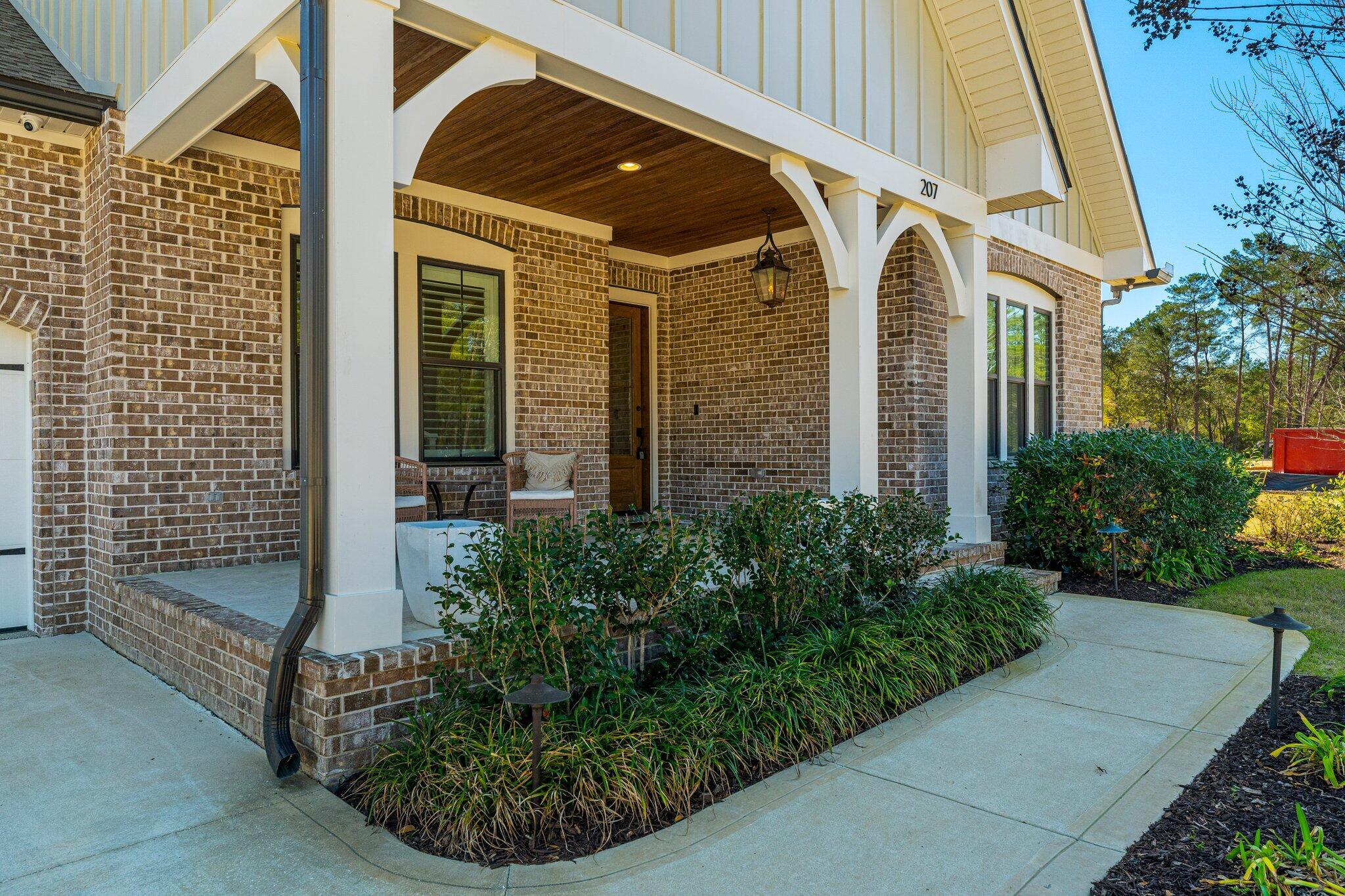 207 Pheasant Way Road Santa Rosa Beach, FL 32459 - Photo 4 of 70 a view of a brick house with plants