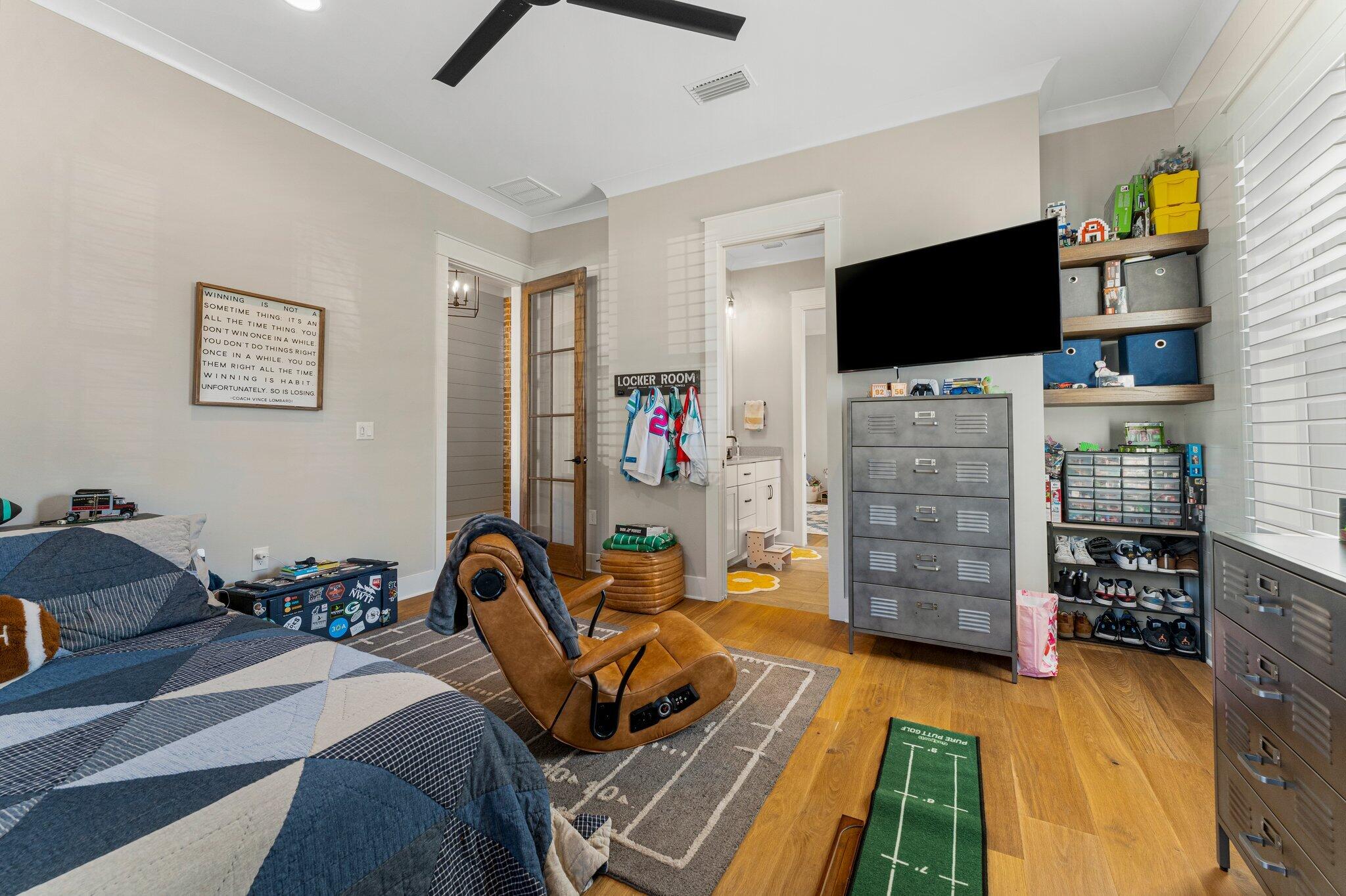 207 Pheasant Way Road Santa Rosa Beach, FL 32459 - Photo 44 of 70 a bedroom with furniture and a flat screen tv