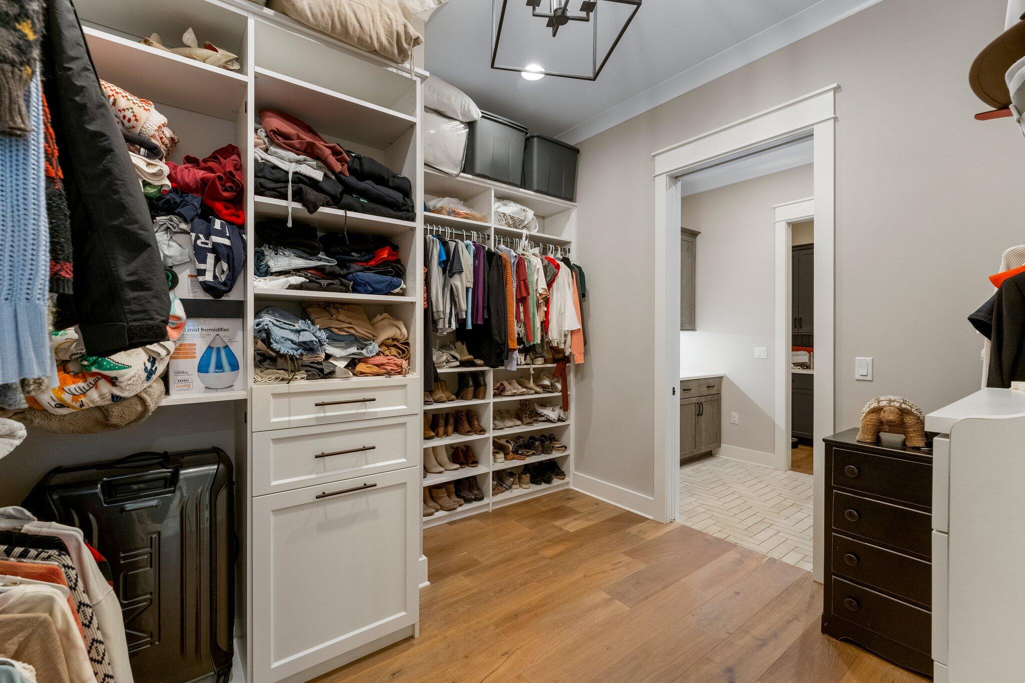 207 Pheasant Way Road Santa Rosa Beach, FL 32459 - Photo 52 of 70 a view of walk in closet with clothes and shoes