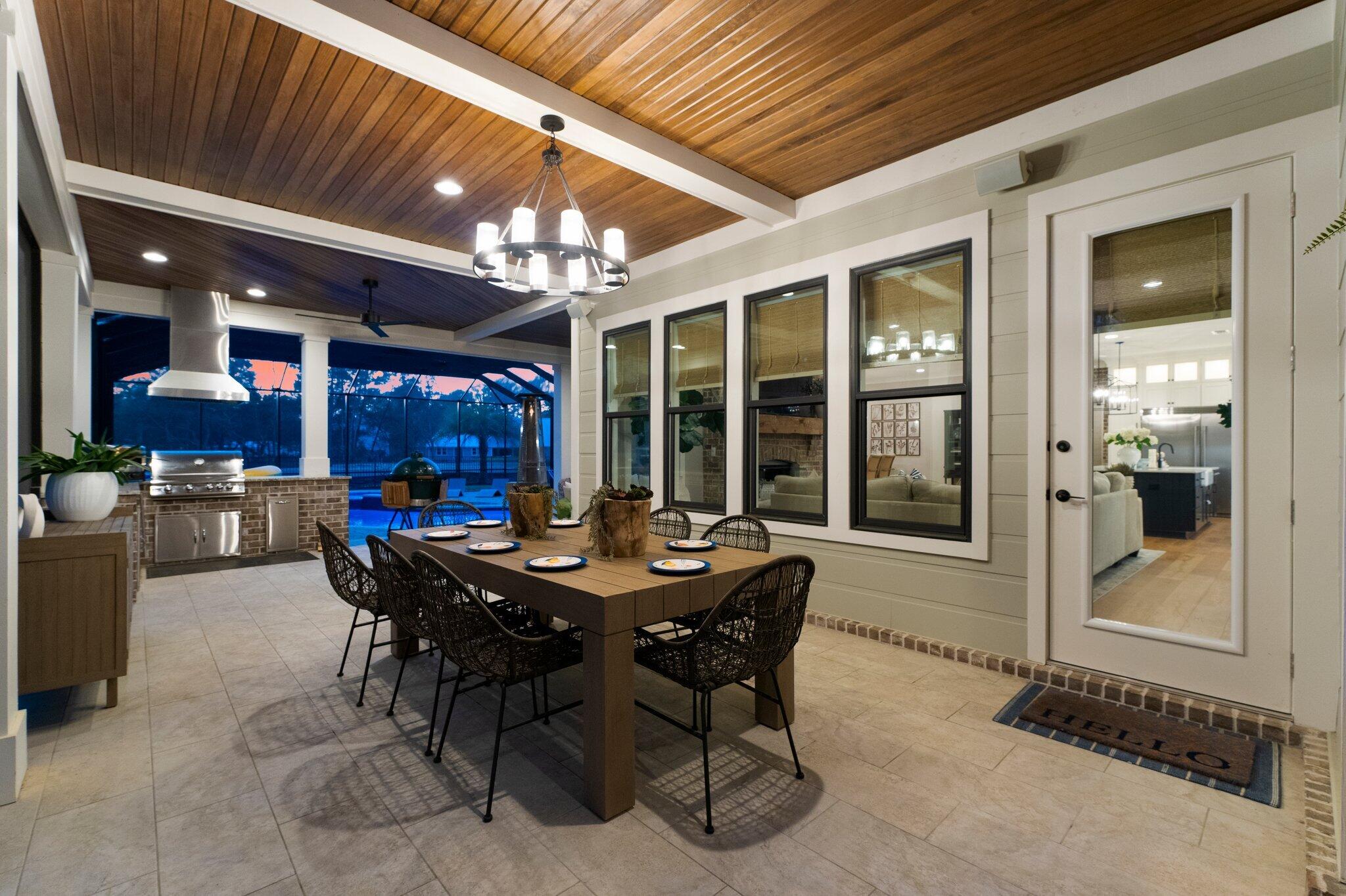 207 Pheasant Way Road Santa Rosa Beach, FL 32459 - Photo 55 of 70 a view of a dining room with furniture and chandelier