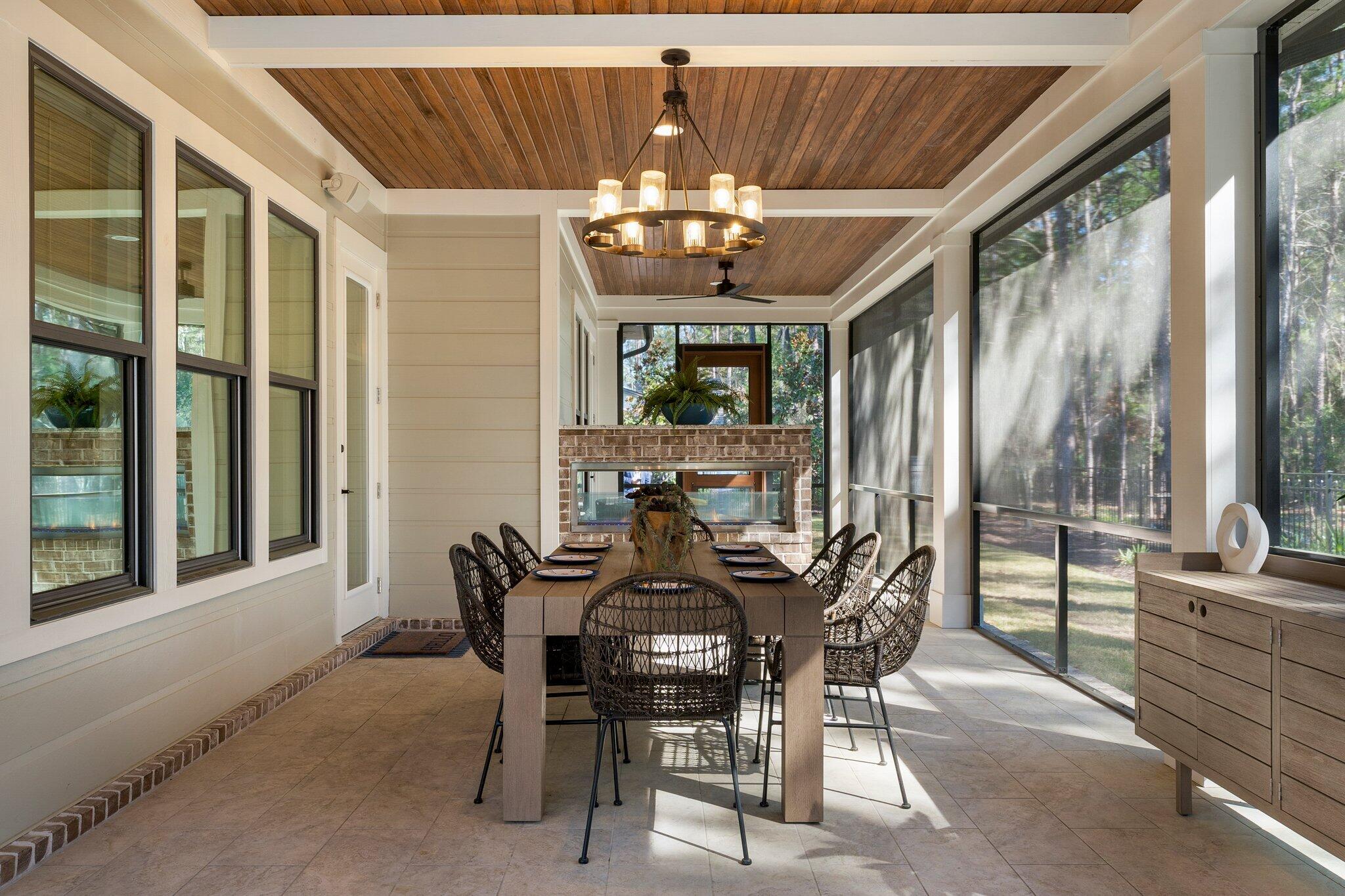 207 Pheasant Way Road Santa Rosa Beach, FL 32459 - Photo 8 of 70 a view of a dining room with furniture a chandelier and a large window