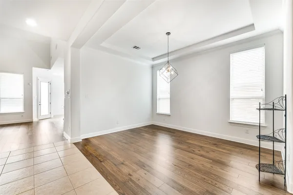 a view of a livingroom with wooden floor