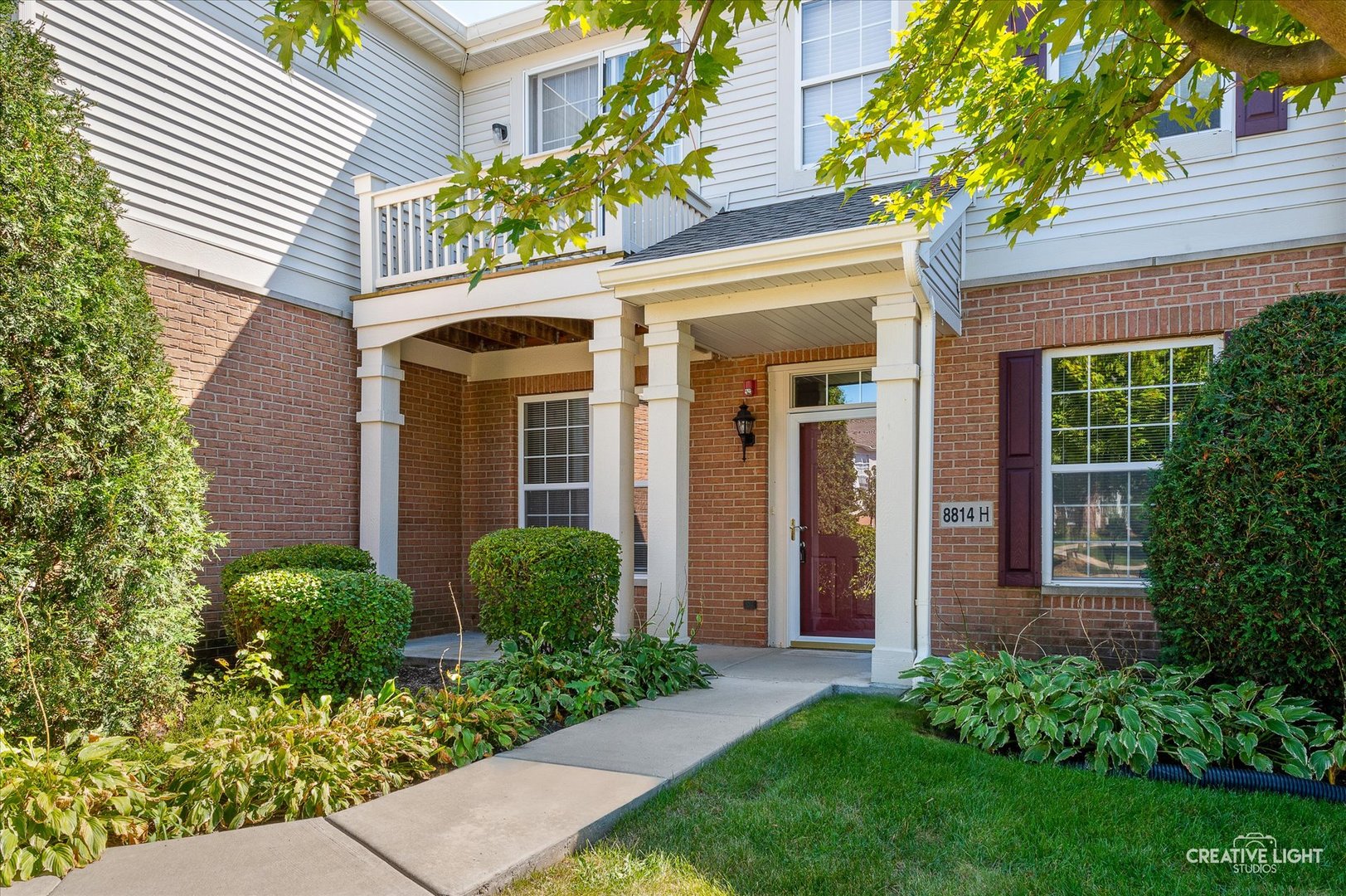 8814 Concord Lane, Unit H Justice, IL 60458 - Photo 2 of 17 front view of a house with a yard