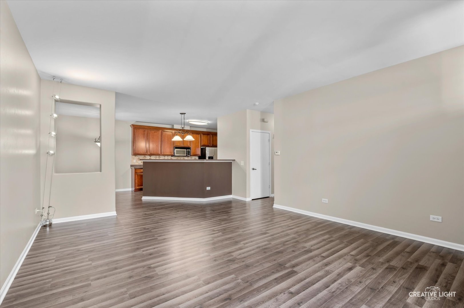 8814 Concord Lane, Unit H Justice, IL 60458 - Photo 4 of 17 a view of a kitchen with a sink and a kitchen counter top space