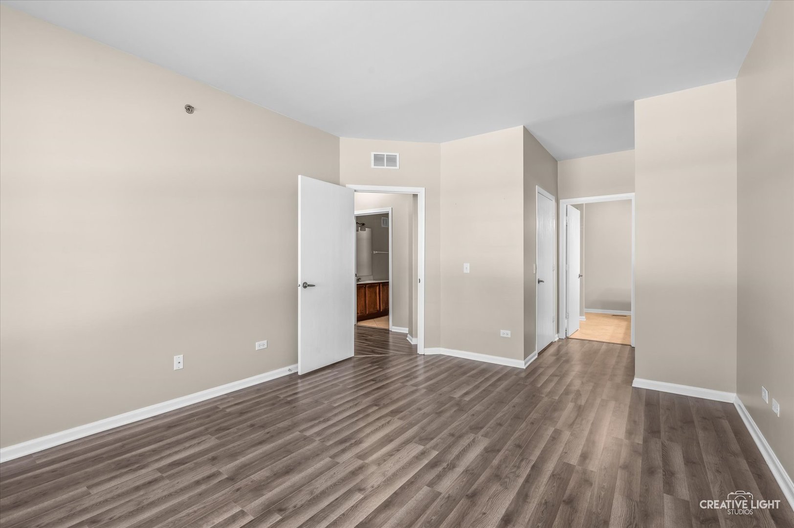 8814 Concord Lane, Unit H Justice, IL 60458 - Photo 9 of 17 a view of an empty room with wooden floor