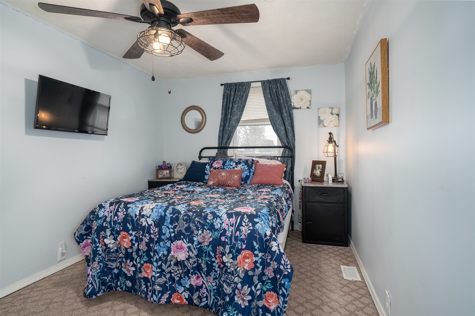 803 Sheridan Street Chenoa, IL 61726 - Photo 11 of 33 a bed room with a bed mirror on wall and a window