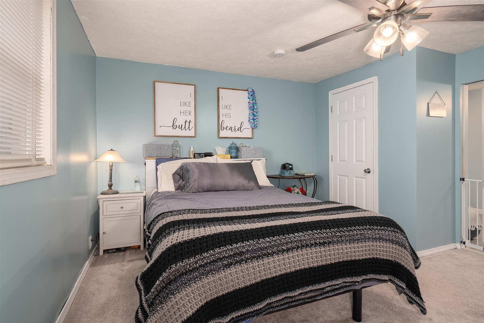 803 Sheridan Street Chenoa, IL 61726 - Photo 15 of 33 a bedroom with a bed and a chandelier