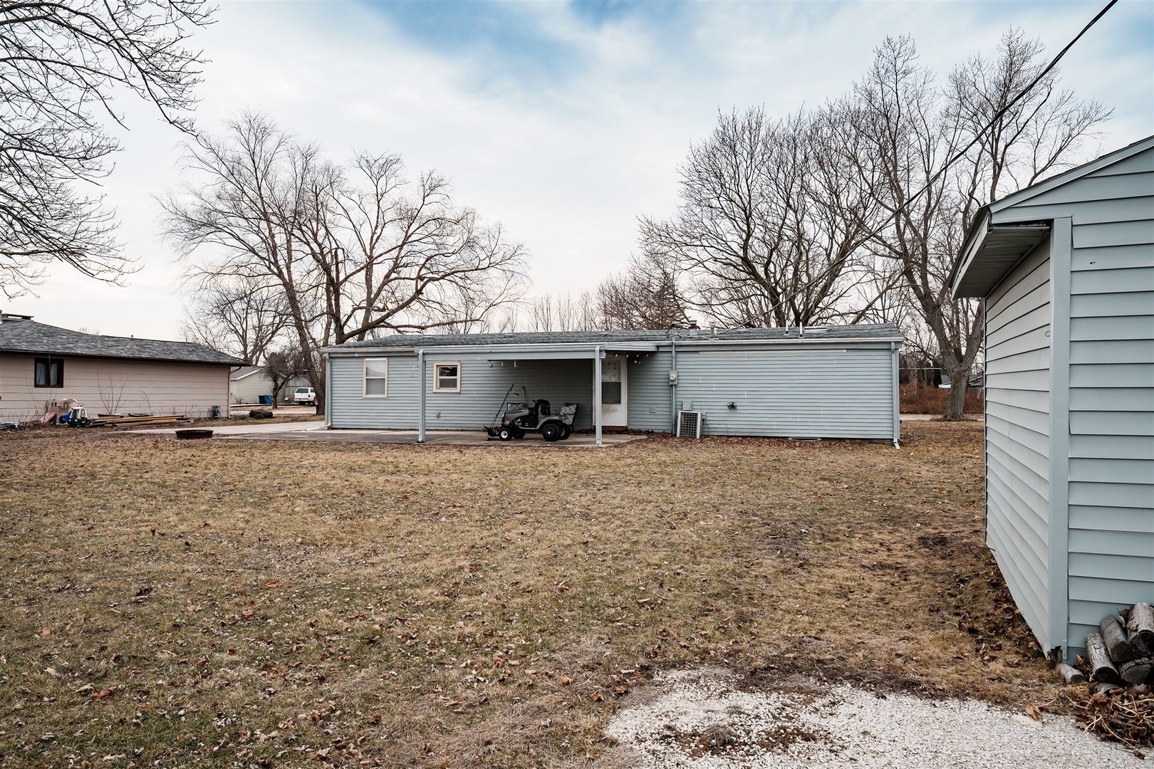 803 Sheridan Street Chenoa, IL 61726 - Photo 29 of 33 a view of a house with a backyard and tree