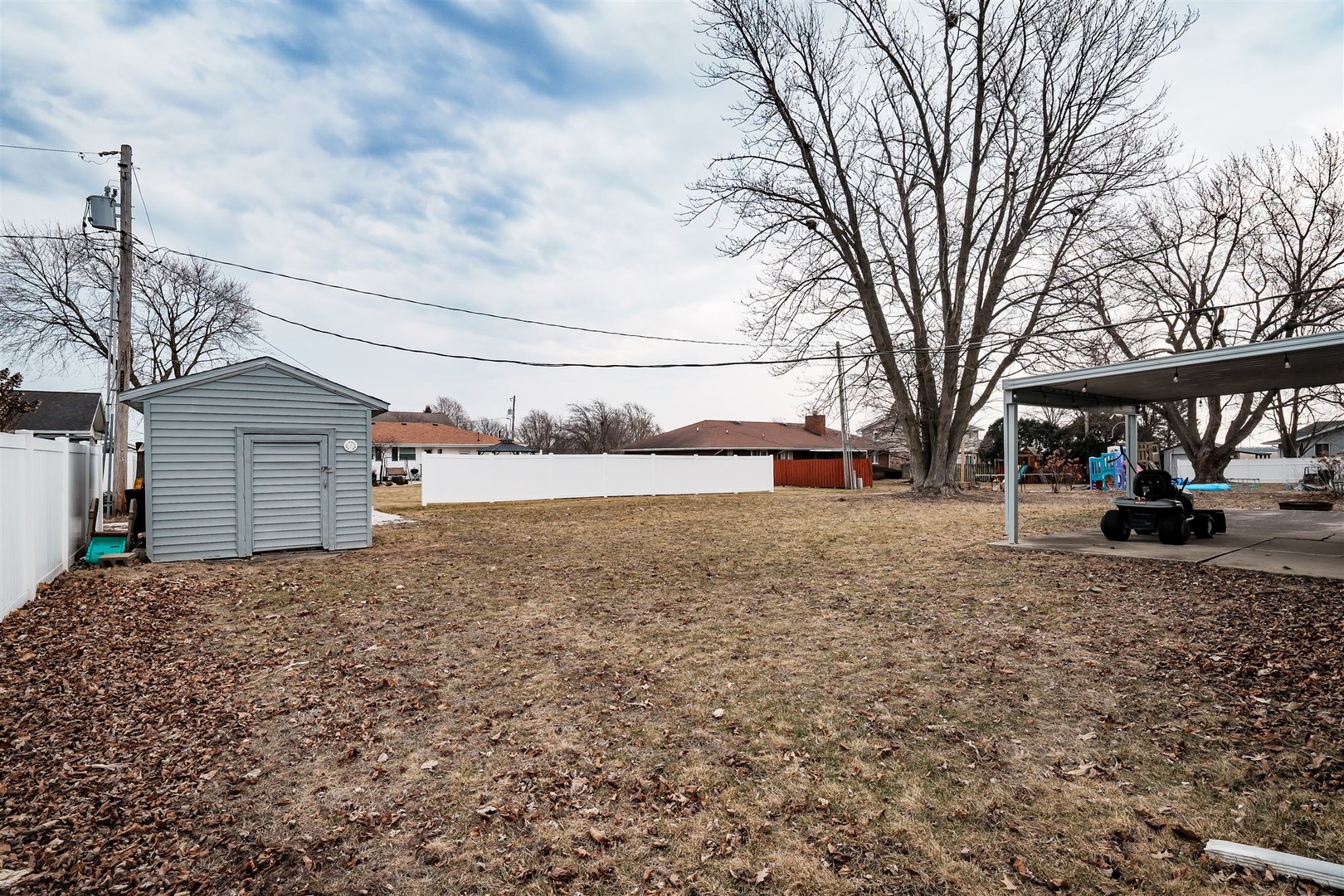803 Sheridan Street Chenoa, IL 61726 - Photo 33 of 33 a view of a yard with a house and a road