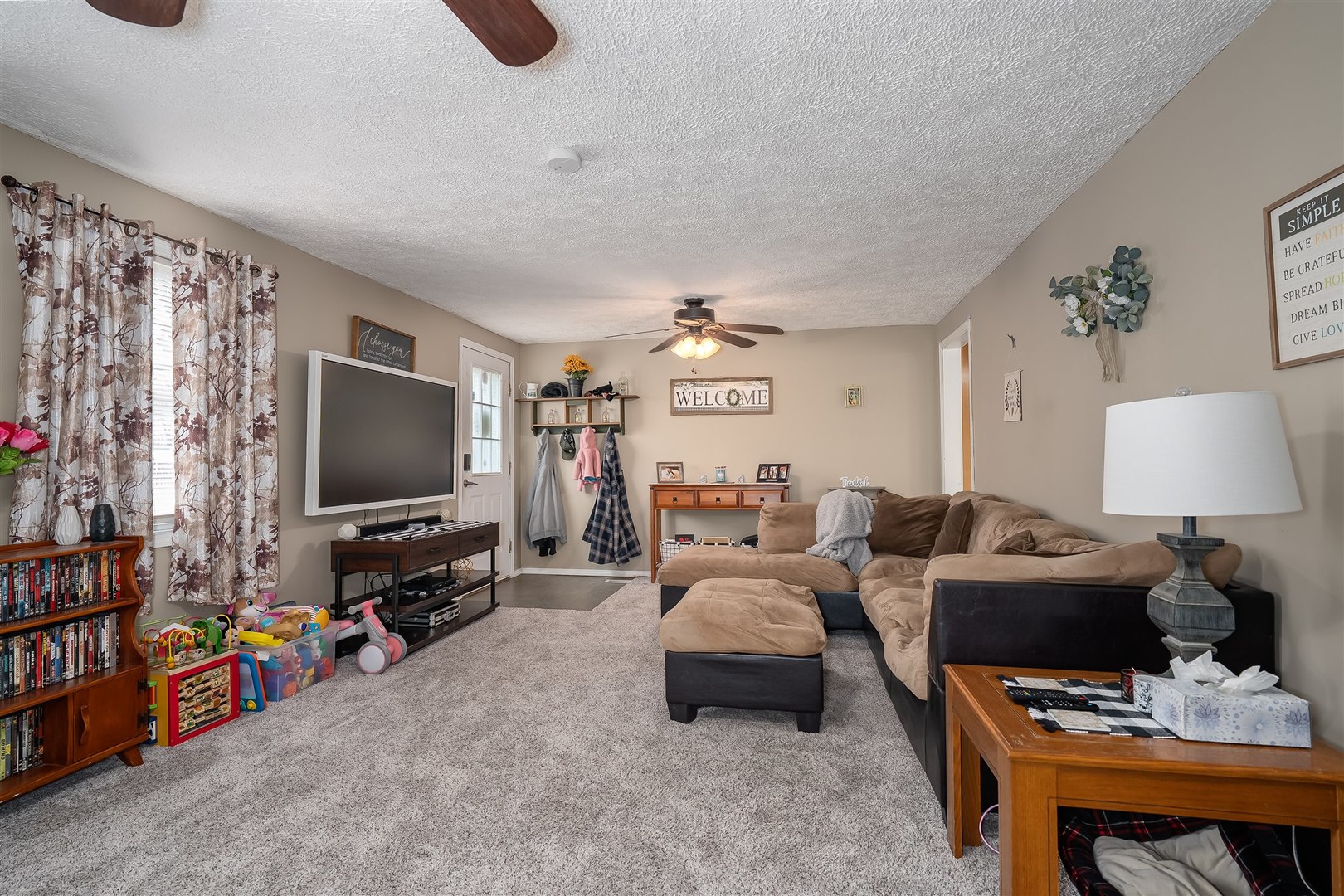 803 Sheridan Street Chenoa, IL 61726 - Photo 5 of 33 a living room with furniture and a flat screen tv