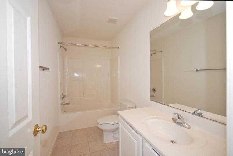 5976 Florey Road Hanover, MD 21076 - Photo 25 of 30 a bathroom with a sink a toilet and shower