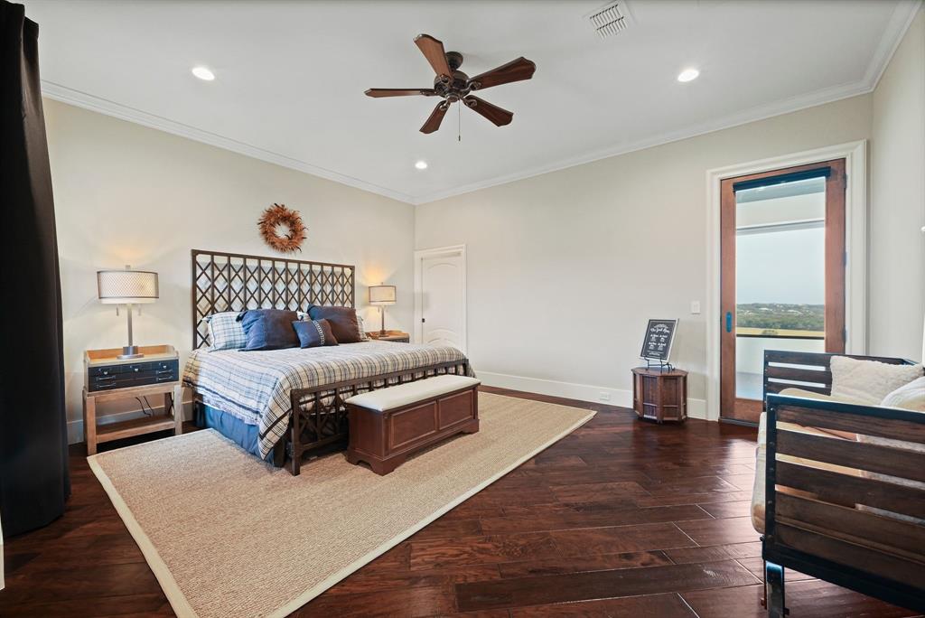 325 River Ridge Spring Branch, TX 78070 - Photo 31 of 40 a bedroom with a bed and wooden floor