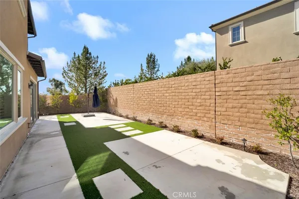 a view of a backyard with sitting area