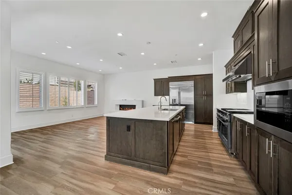 a view of kitchen with sink microwave and stove