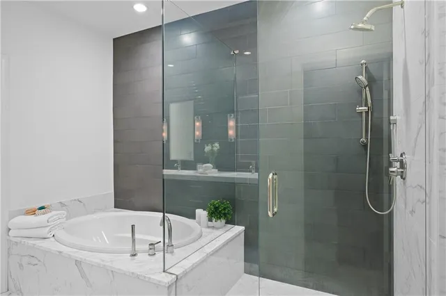 a bathroom with a tub and shower