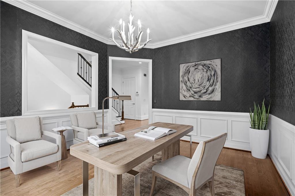 3681 Manor Brook Terrace Atlanta, GA 30319 - Photo 20 of 22 a view of a dining room with furniture a chandelier and wooden floor