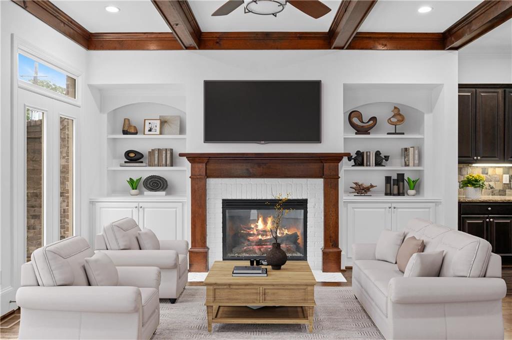3681 Manor Brook Terrace Atlanta, GA 30319 - Photo 2 of 22 a living room with furniture and a fireplace