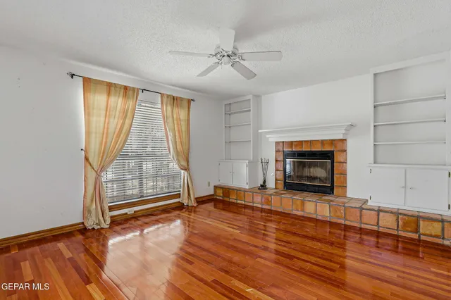 a view of a livingroom with wooden floor