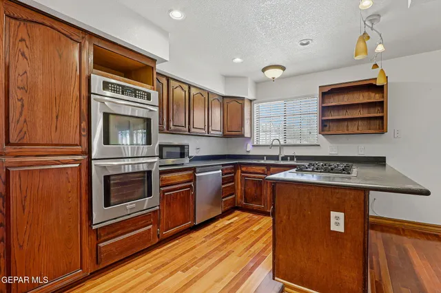 a kitchen with a stove and a microwave