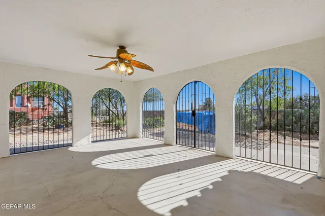 a balcony with wooden floor and outdoor seating