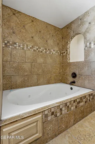 a view of a workspace with furniture and a potted plant