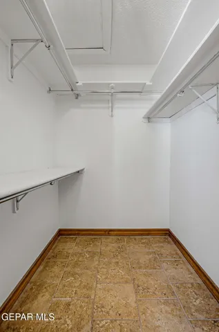 a living room with furniture a bookshelf and a bookshelf