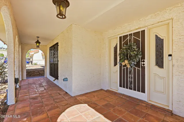 a view of staircase with railing and windows