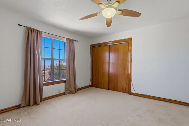 an aerial view of a house with a yard sitting space