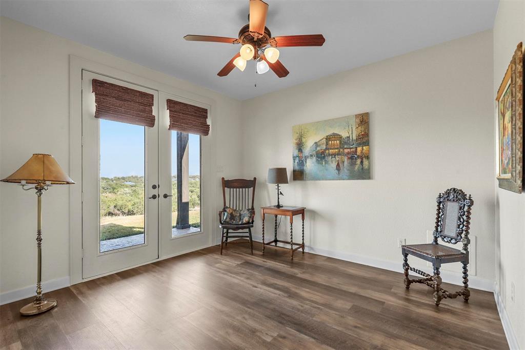 701 Cactus Rio Weatherford, TX 76087 - Photo 26 of 40 a view of a livingroom with furniture wooden floor a chandelier and windows