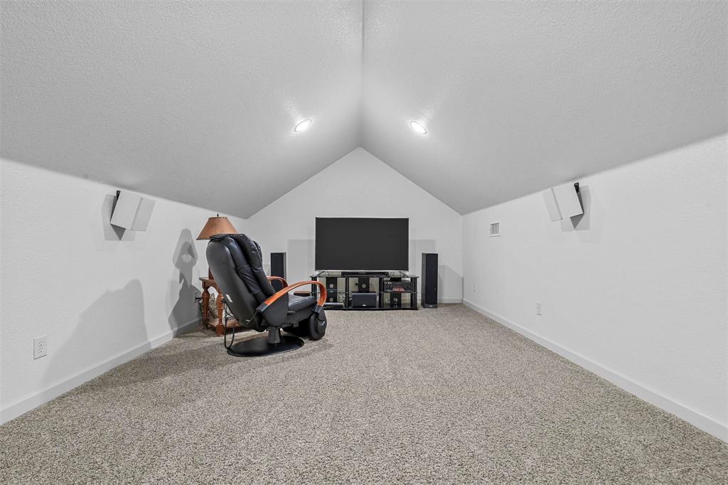701 Cactus Rio Weatherford, TX 76087 - Photo 29 of 40 a living room with furniture and a flat screen tv