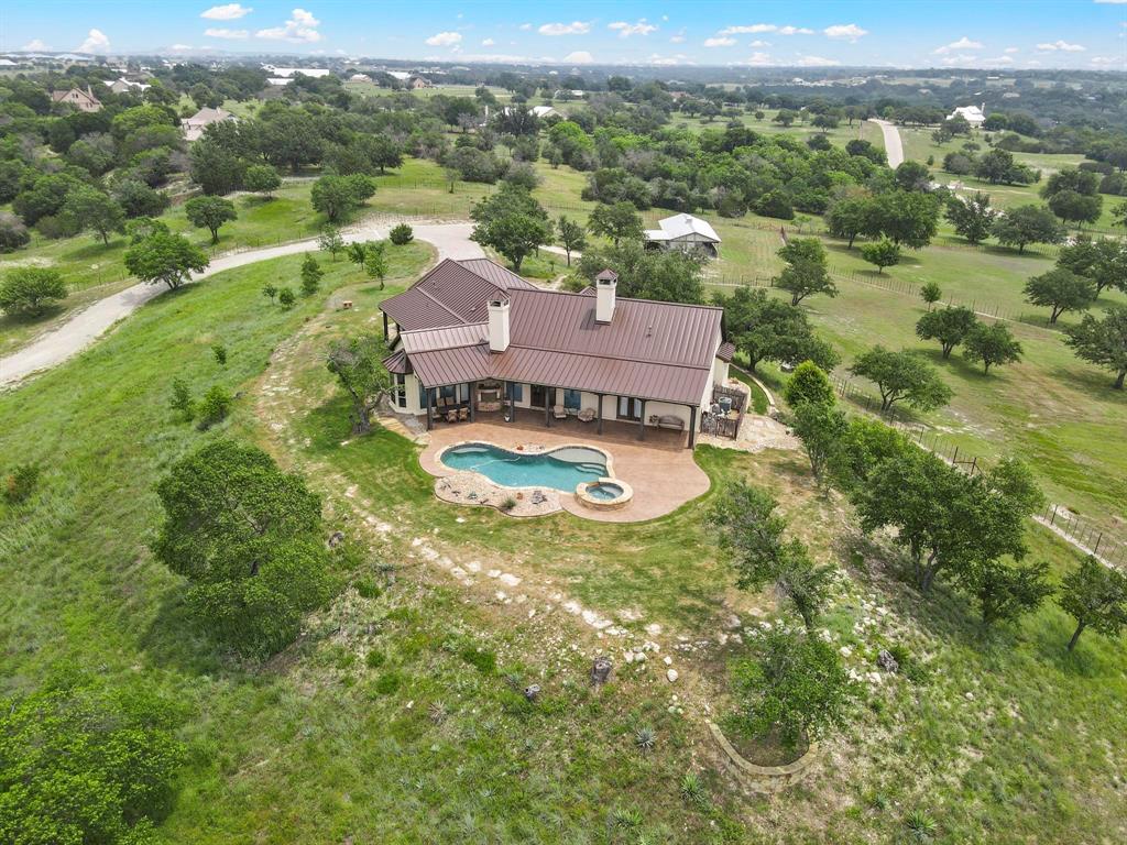 701 Cactus Rio Weatherford, TX 76087 - Photo 3 of 40 an aerial view of residential houses with outdoor space and trees