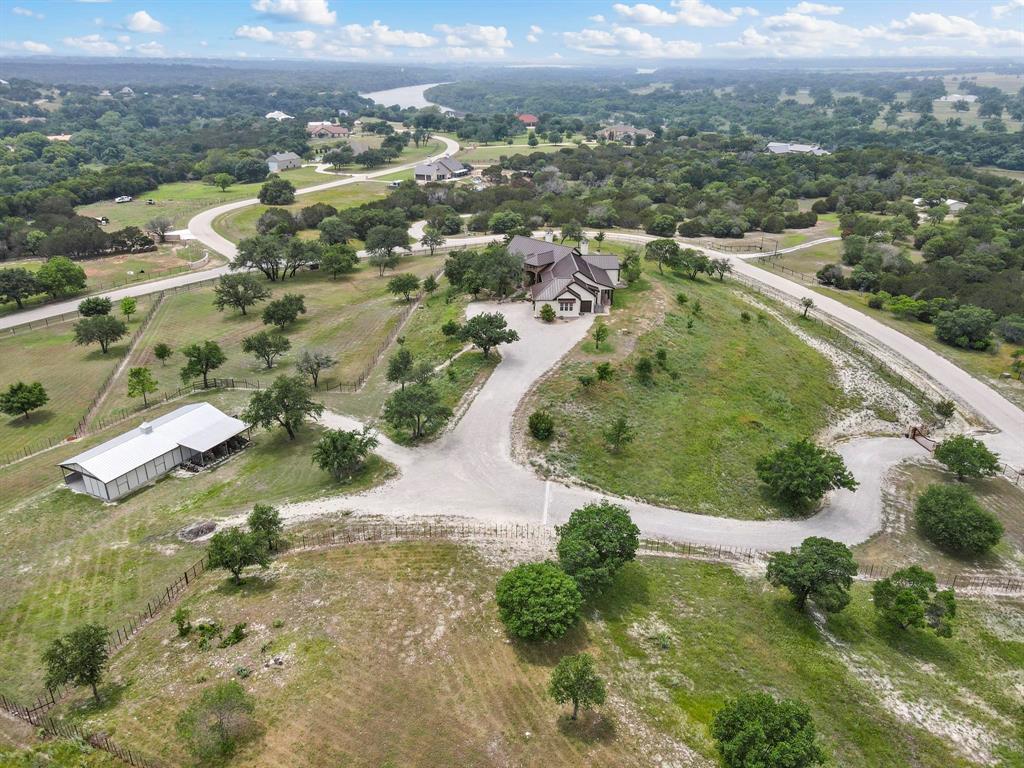 701 Cactus Rio Weatherford, TX 76087 - Photo 37 of 40 an aerial view of residential houses with outdoor space and trees