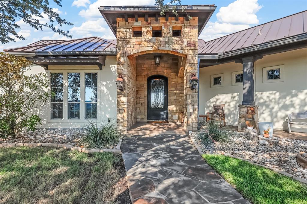 701 Cactus Rio Weatherford, TX 76087 - Photo 5 of 40 a front view of a house with garden