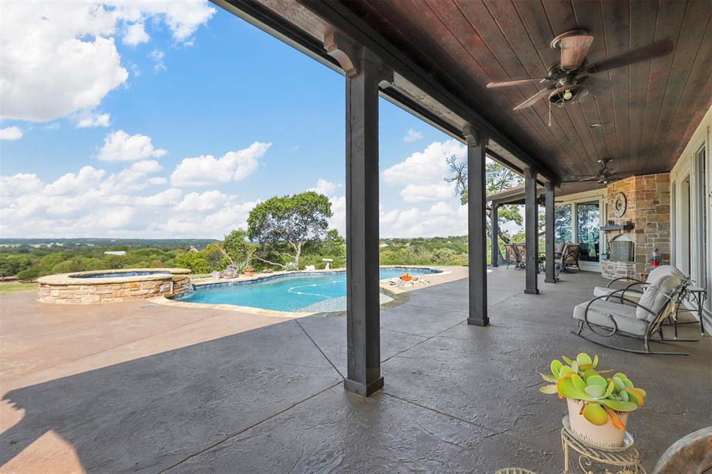 701 Cactus Rio Weatherford, TX 76087 - Photo 8 of 40 a view of a porch with furniture and a floor to ceiling window