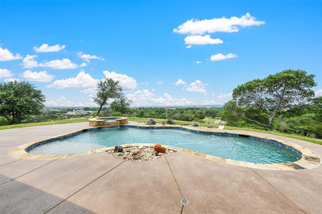 701 Cactus Rio Weatherford, TX 76087 - Photo 9 of 40 a view of a swimming pool and an outdoor space