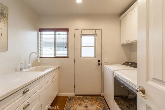 a bathroom with a sink and a washing machine