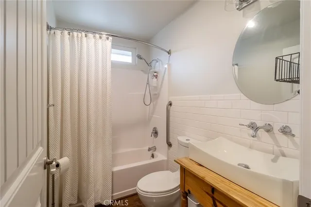 a bathroom with a sink a toilet and a bathtub