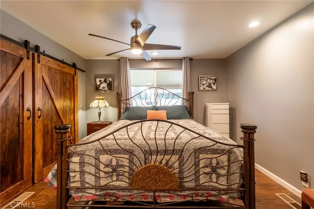 a bed sitting in a bedroom next to a window
