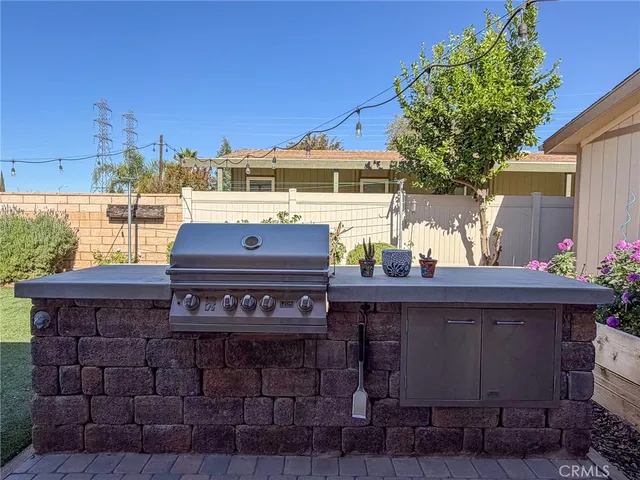 a view of a chairs and table in the patio