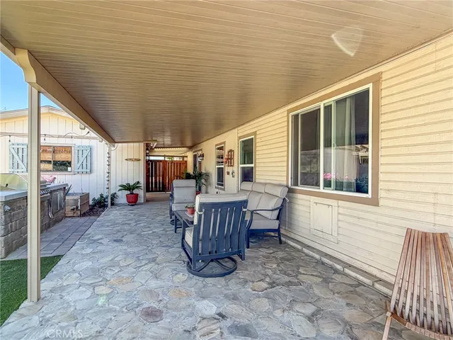 a view of a porch with furniture