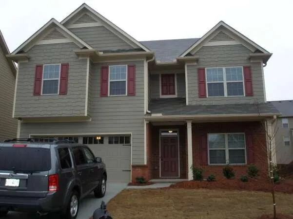 a view of a house with a car park