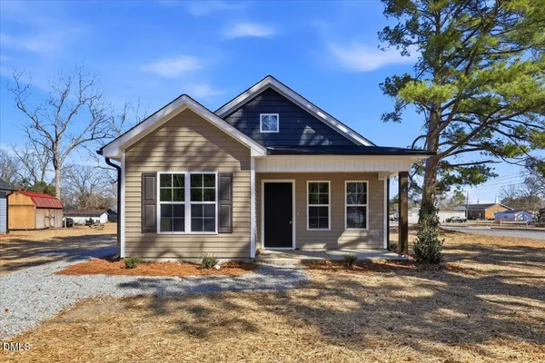 a front view of a house with a porch