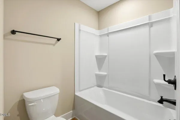 a bathroom with a granite countertop sink mirror vanity and a window