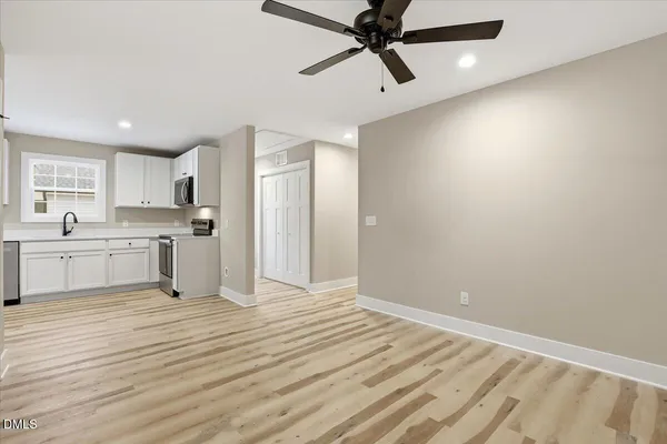 a kitchen with granite countertop a sink and a stove top oven