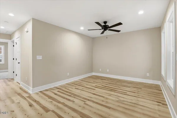 a view of a kitchen with a sink cabinets and stainless steel appliances